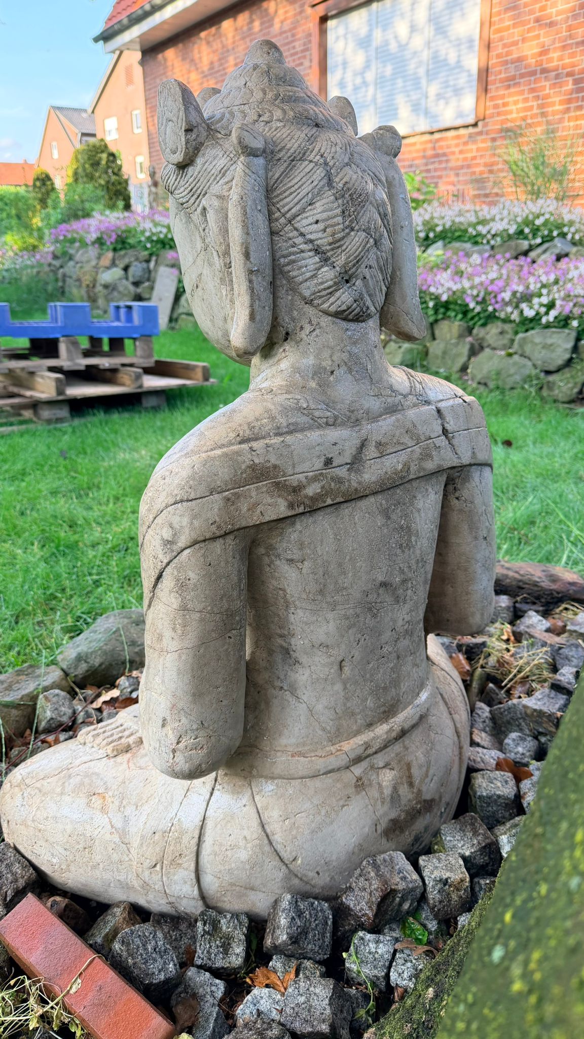 Monumental temple figure in natural stone with spiritual significance