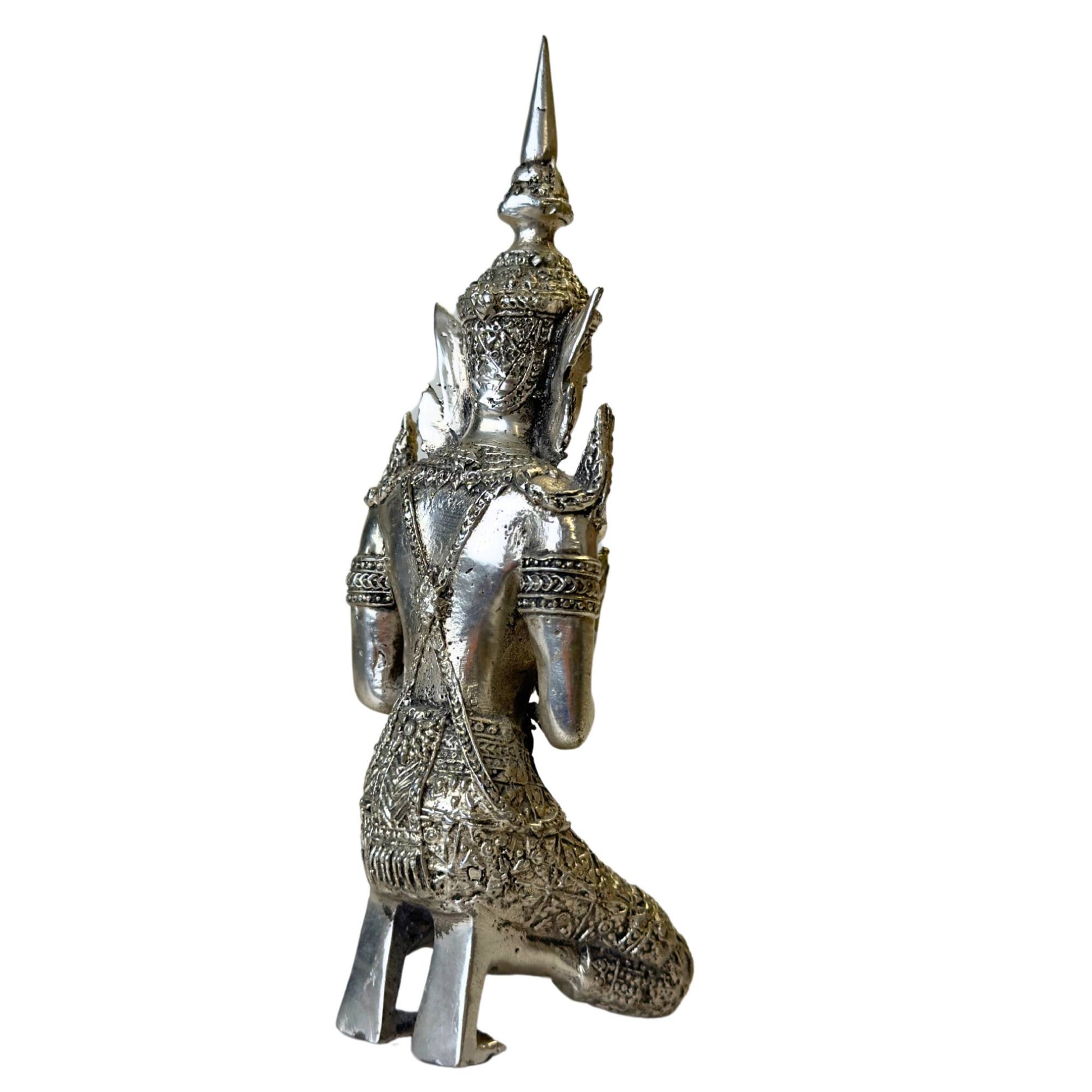 The unique texture and antique finish of the silver ornament.