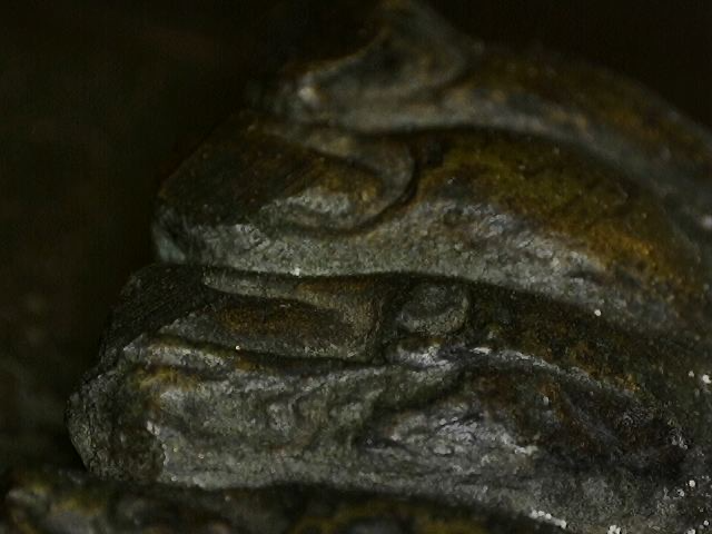 Microscope detail of natural corrosion on Thai bronze sculpture