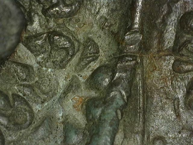 Detail of Thai bronze sculpture with old patina and decorative finish