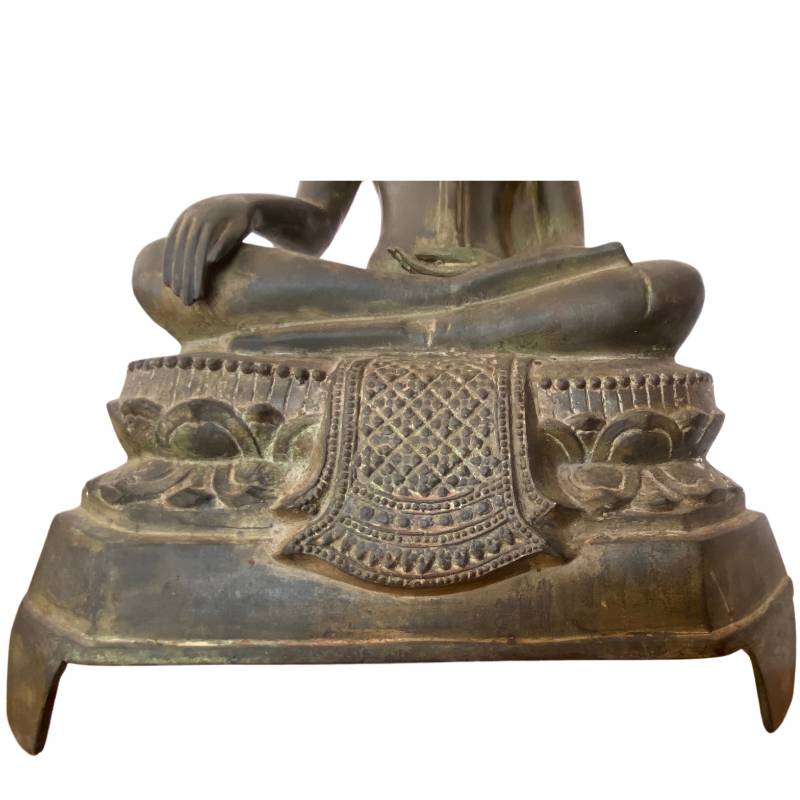 Thai Buddha statue seated on a lotus-shaped base