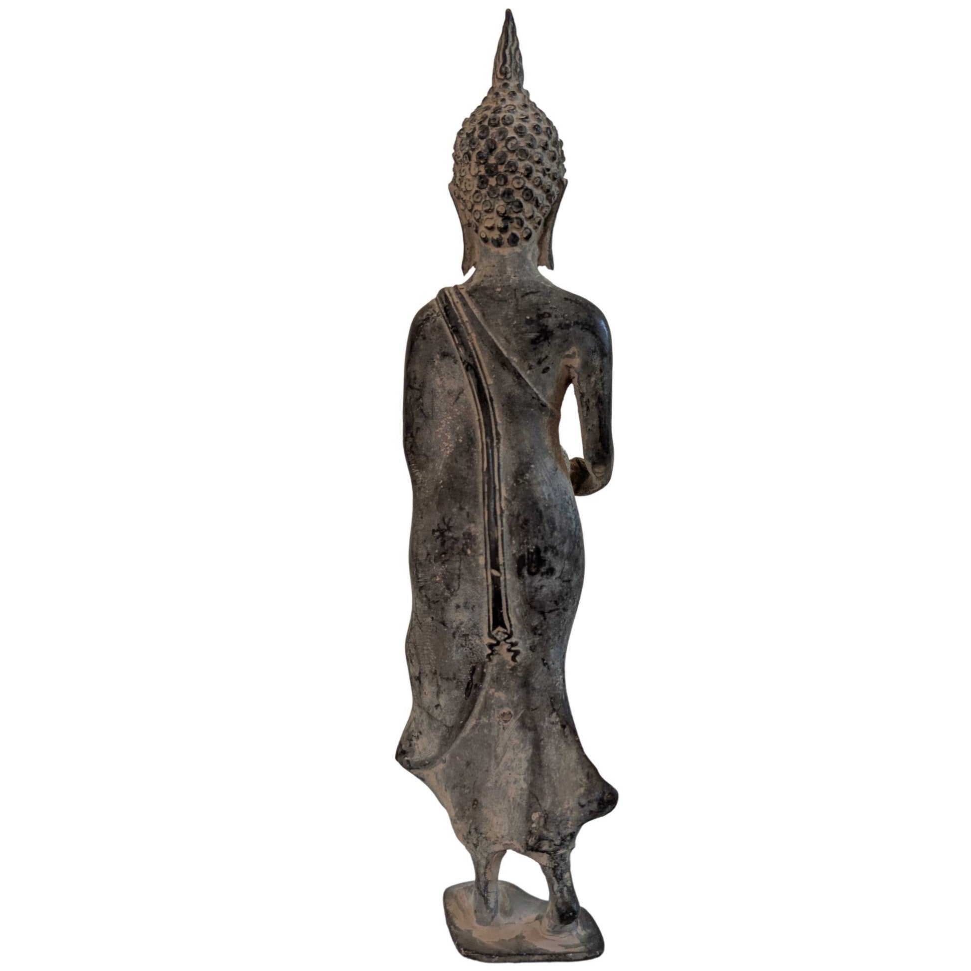 Cast bronze Thai Buddha with the patra bowl in his right hand.