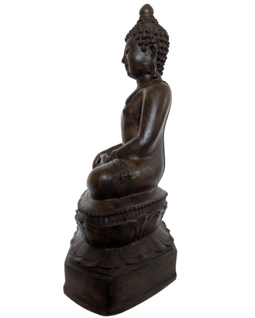 Seated bronze Buddha on a detailed lotus base, Thai tradition.
