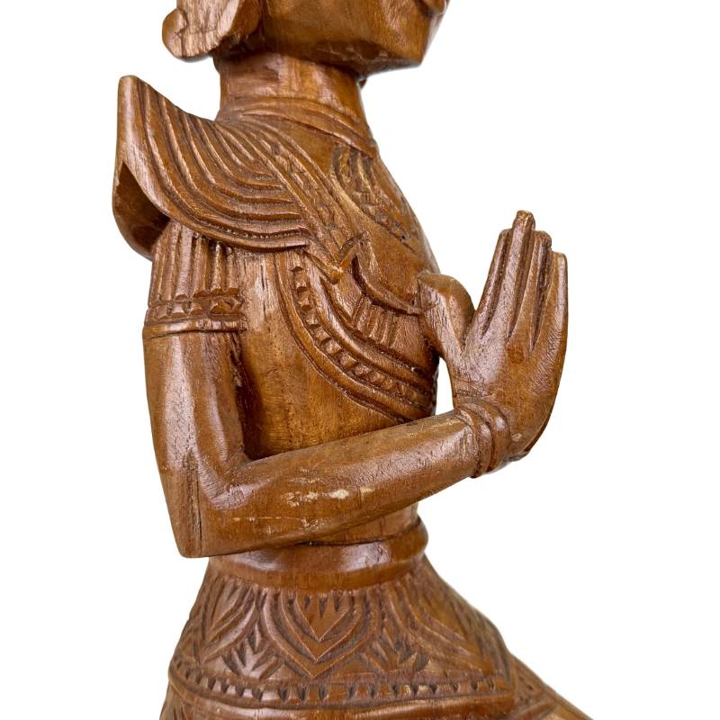 Thai woodcarving statue kneeling with traditional crown