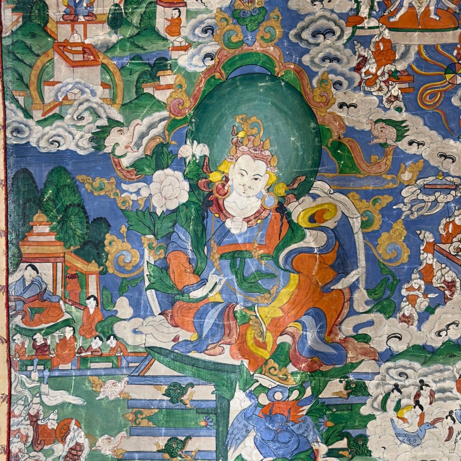 Narrative detail of the thangka with riders and elephants in a traditional Himalayan landscape