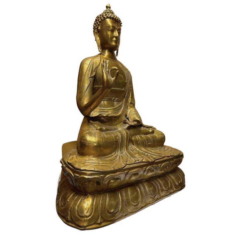 Tibetan Buddha statue with Abhaya mudra, the posture of protection and reassurance