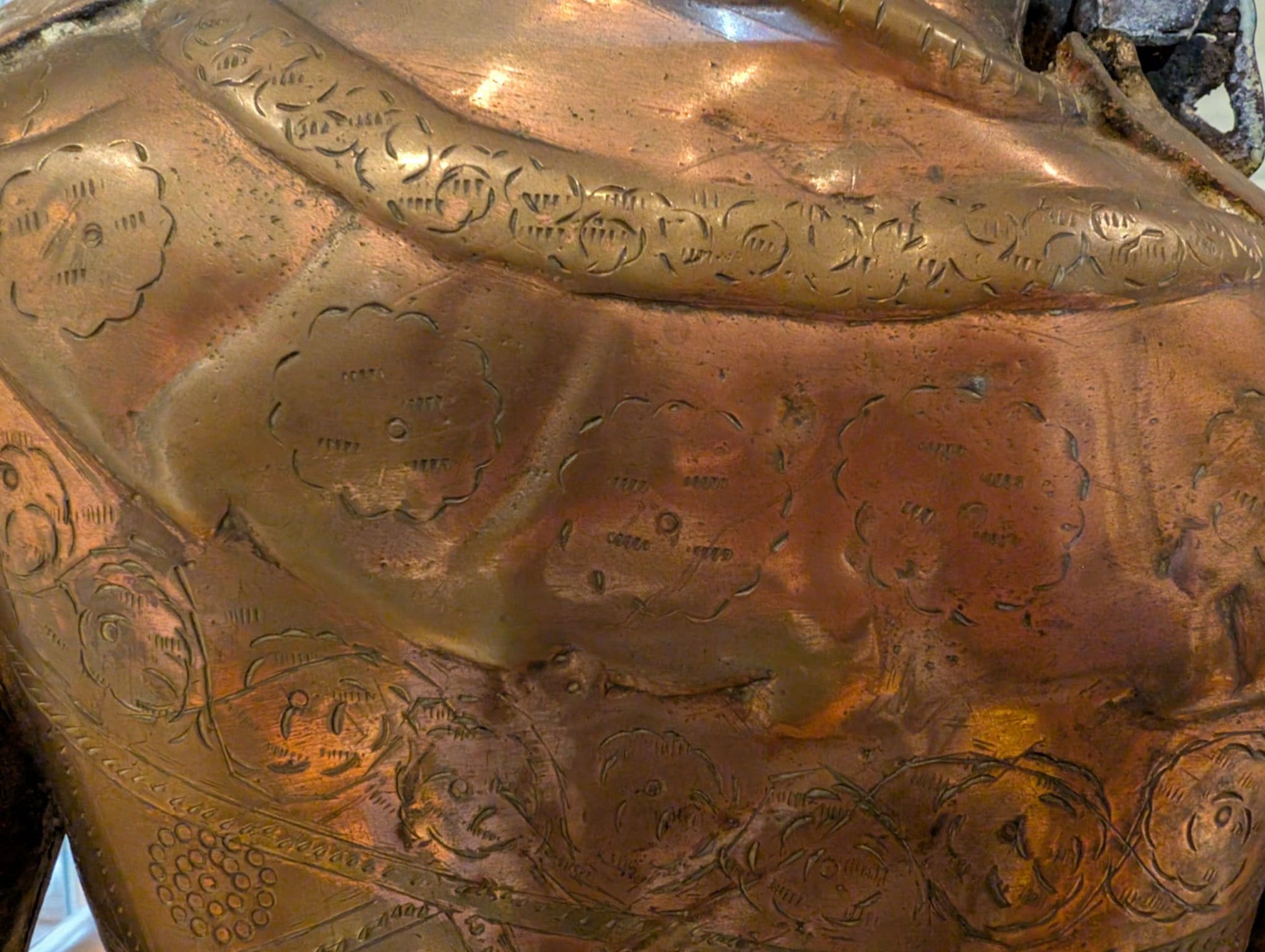 Tibetan Tara statue in bronze with fire gilding visible in patina