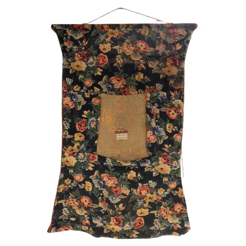 Traditional Tibetan thangka with sacred mandala and symbolic figures