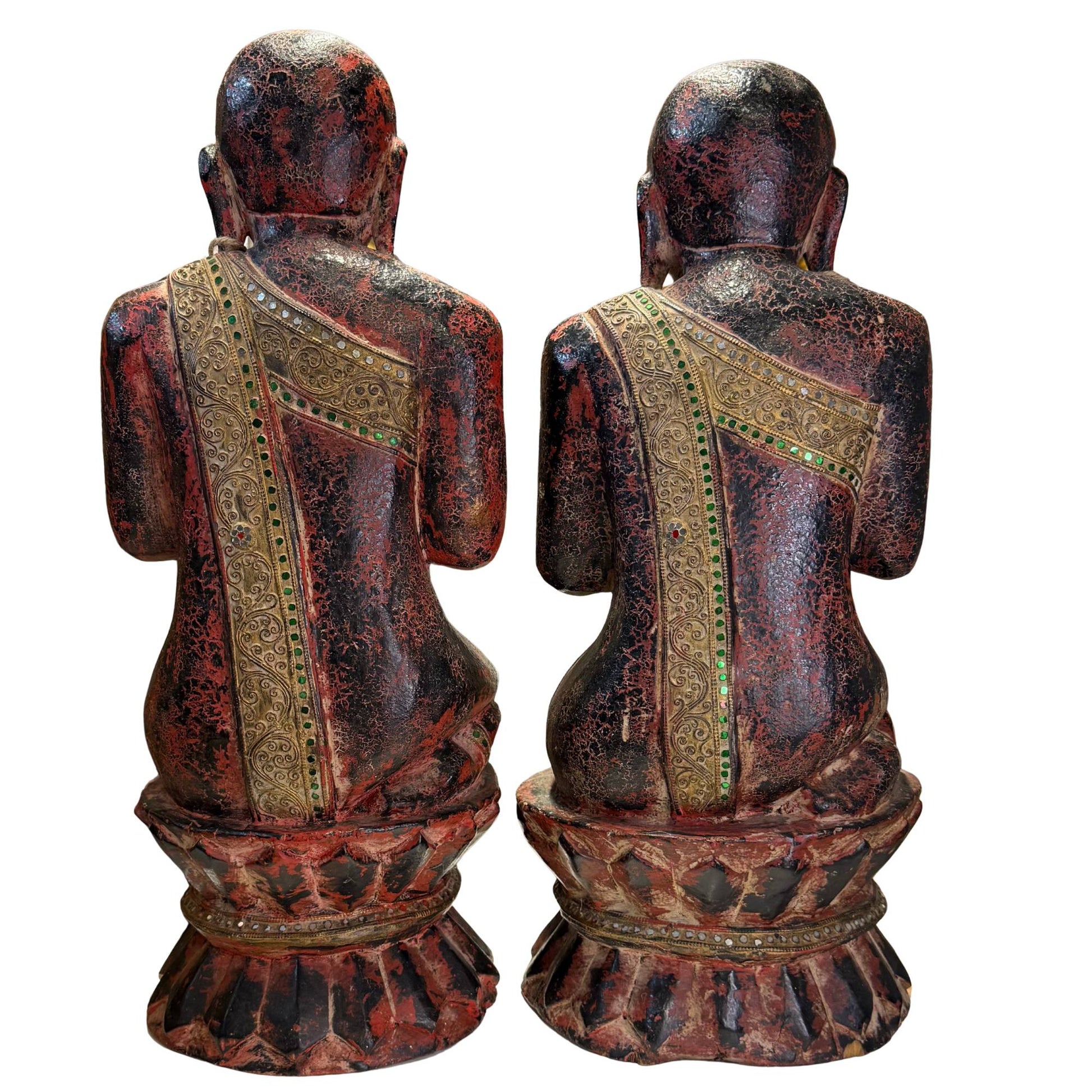 Detail of the traditional Burmese mirror-glass mosaic on the robes of the statues.