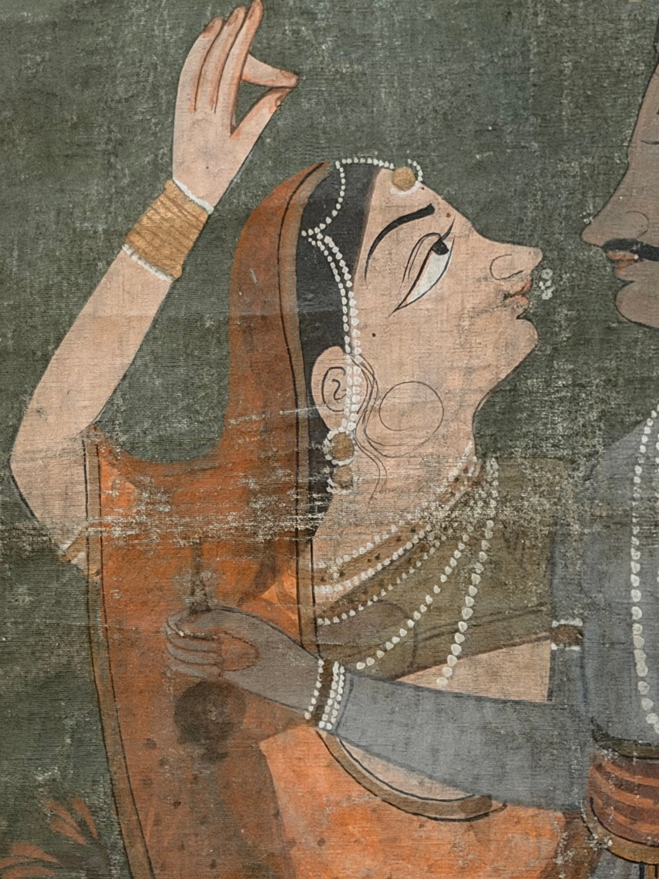 Traditional Indian painting of Krishna with female figures