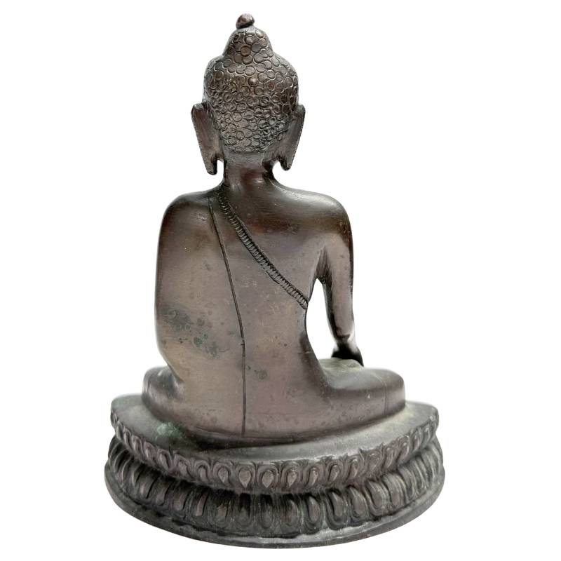 Traditional Nepalese Buddha seated on lotus base in bronze
