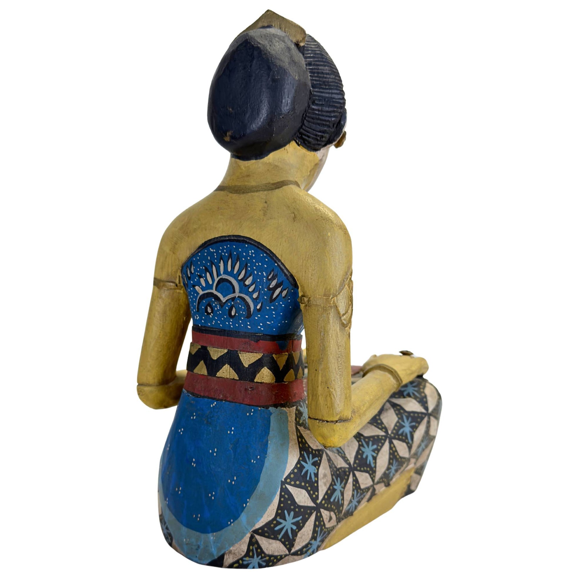 Detail of the painted batik patterns on the clothing of the statues.