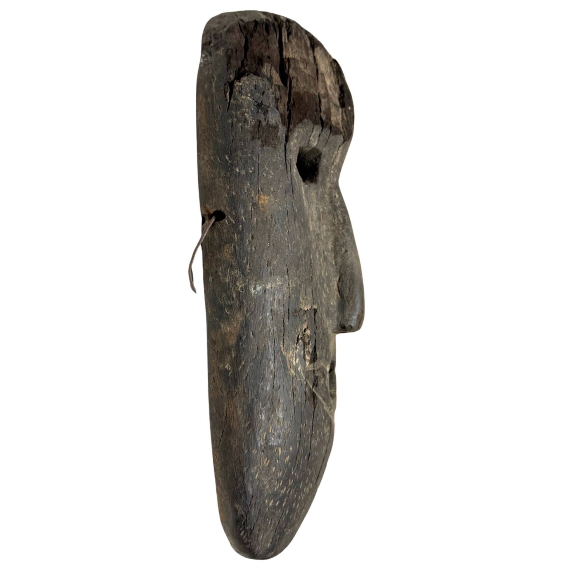 Tribal wooden mask from the Himalayas, antique shamanistic wall mask with a broad shape and weathered surface