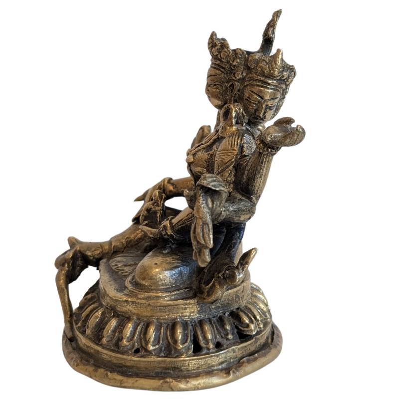 Bronze Ushnishavijaya with multiple arms and serene posture