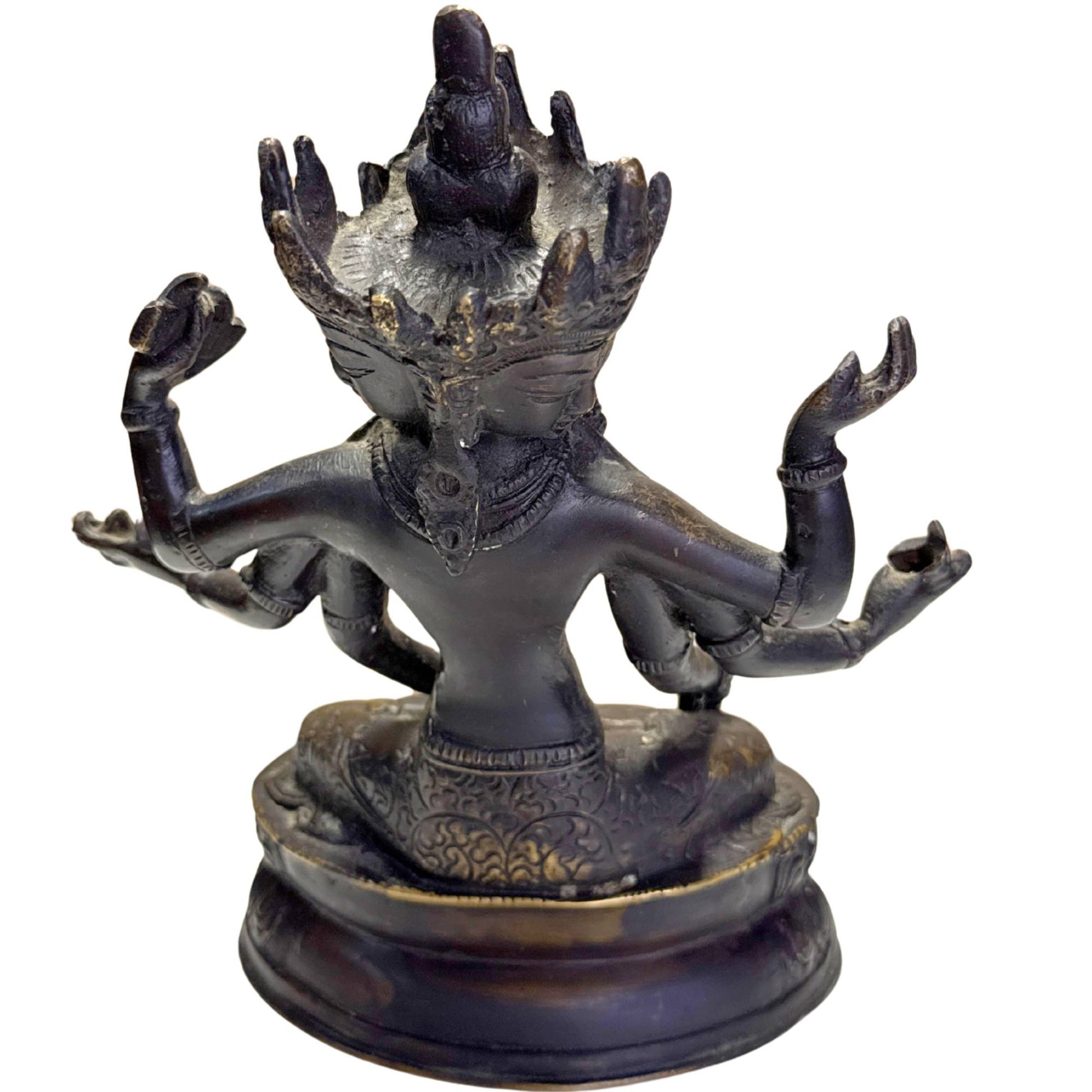 Ushnishavijaya as a Tantric Buddhist statue with multiple arms and a ritual aura