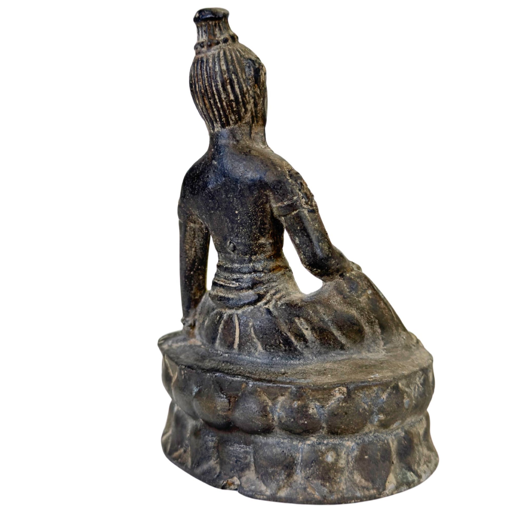 detail face Vasudhara statue serene smile antique bronze