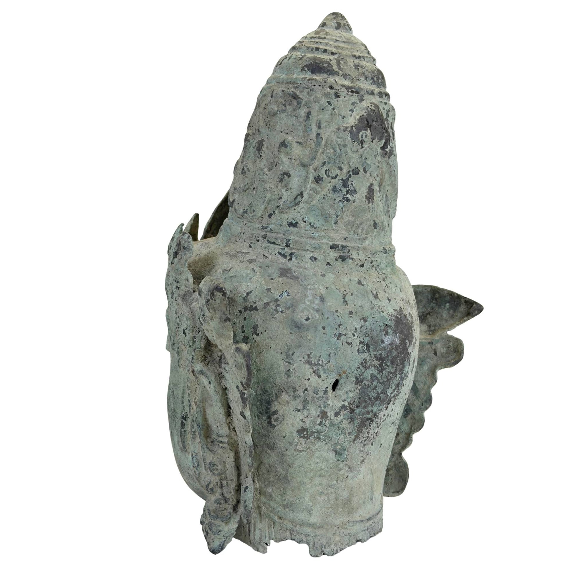 Natural verdigris patina on a bronze Vishnu head from Indonesia