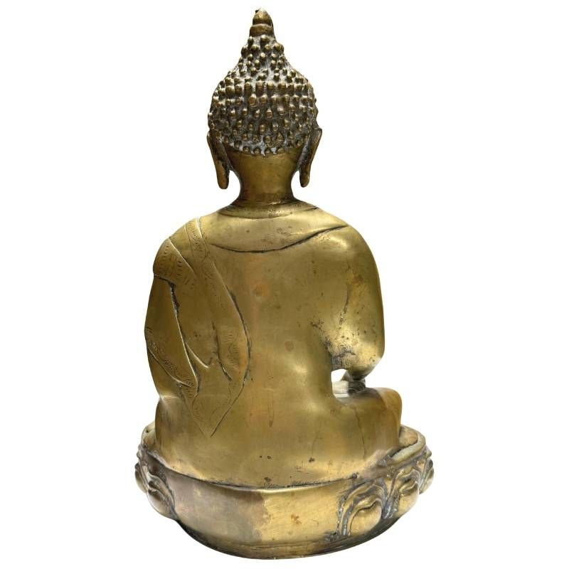 Antique gilded Buddha statue on a lotus throne from the Asian tradition