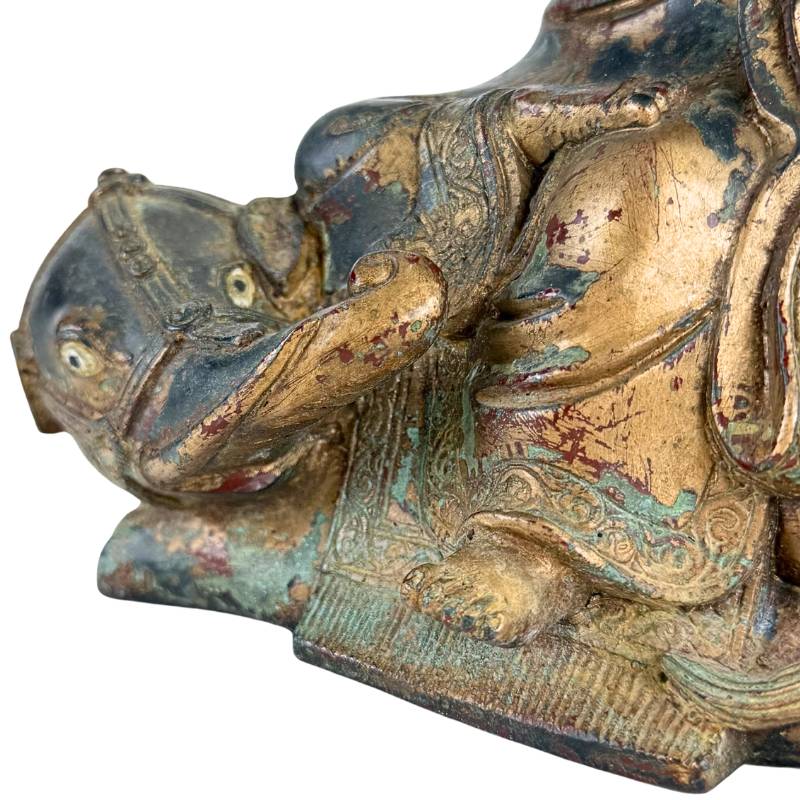 Gilded bronze Arhat on an animal from Himalayan tradition
