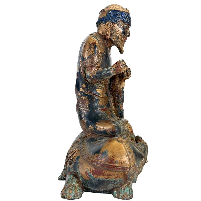Gilded bronze Arhat on Dano from Himalayan art