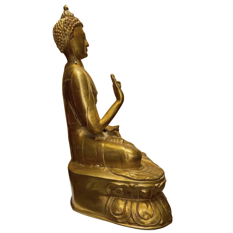 Gilded bronze Buddha statue from the Tibetan monastic tradition with a powerful spiritual aura
