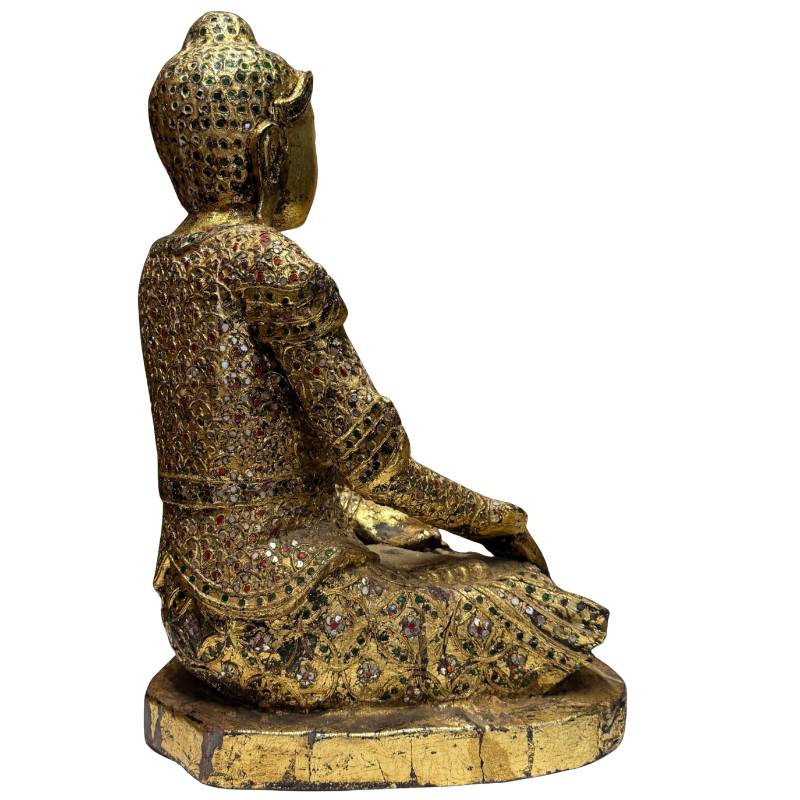 Gilded Buddha from Myanmar with colored glass decoration and a rich ritual appearance