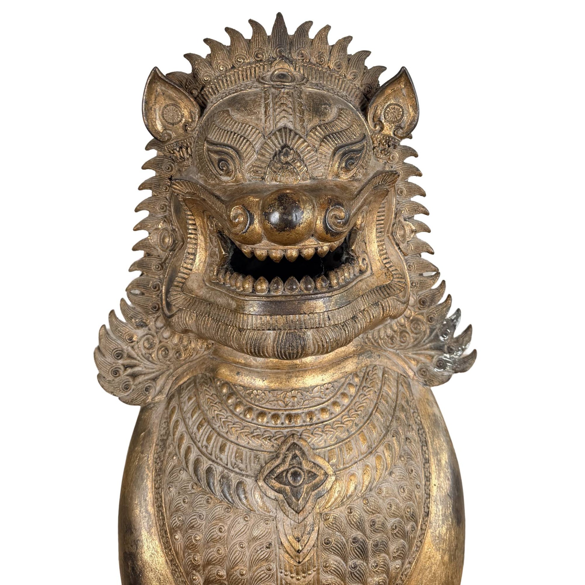 Gilded Siamese lion from temple art, antique Buddhist statue with impressive ceremonial power