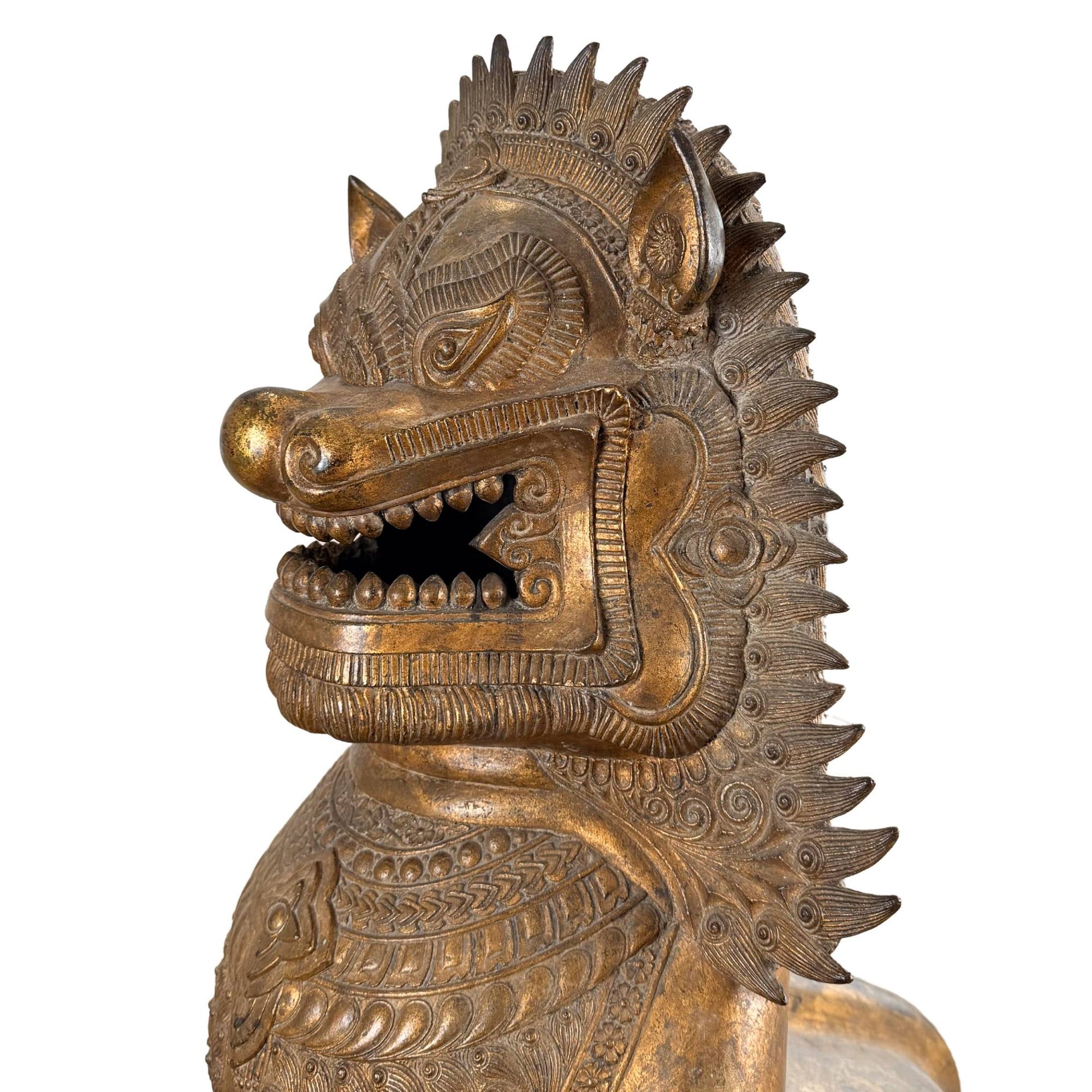 Gilded Singha temple lion from Siam, antique Buddhist guardian statue with a powerful protective aura