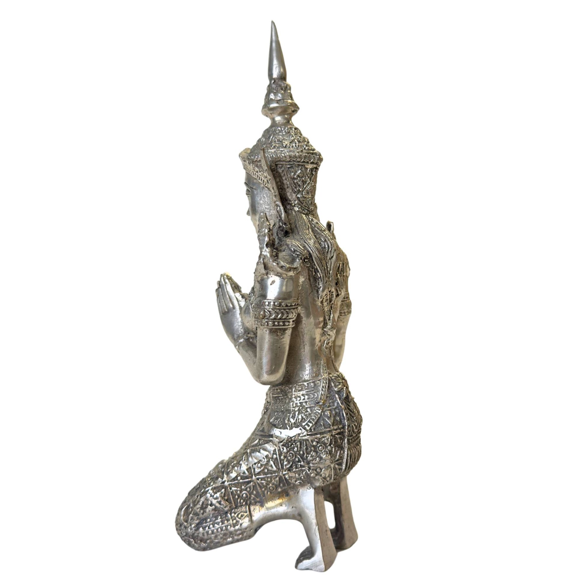 Silver-plated Thai guard statue for protection and harmony.