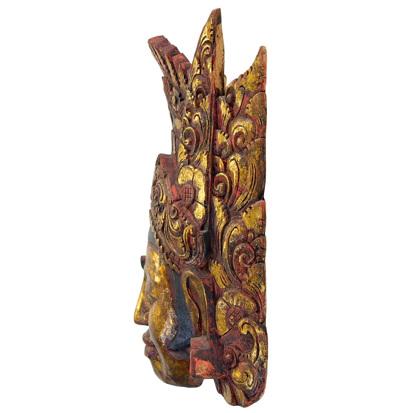 Left side view of the vintage Indonesian temple mask from Bali, clearly showing the thickness and organic structure of the Pule wood.