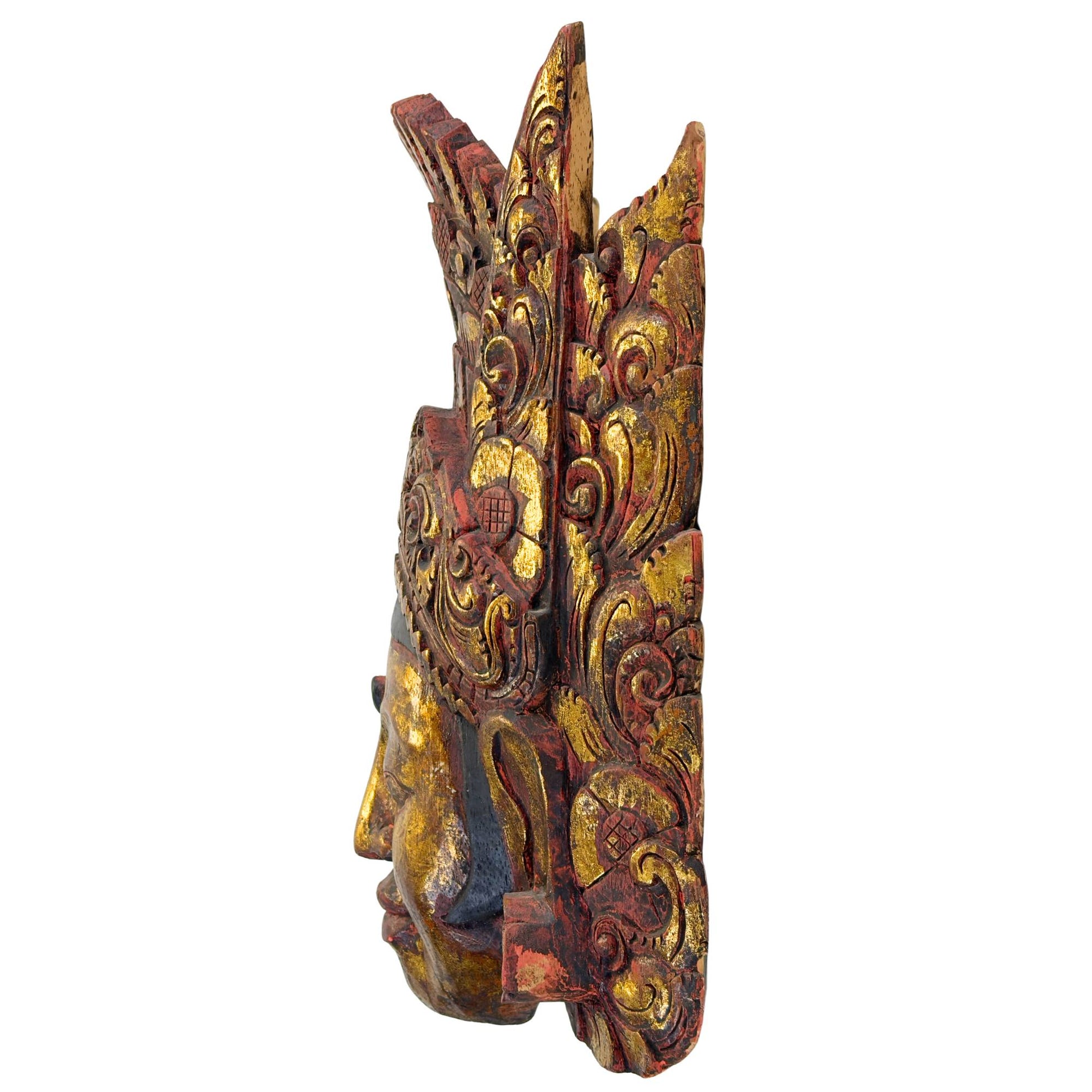 Left side view of the vintage Indonesian temple mask from Bali, clearly showing the thickness and organic structure of the Pule wood.