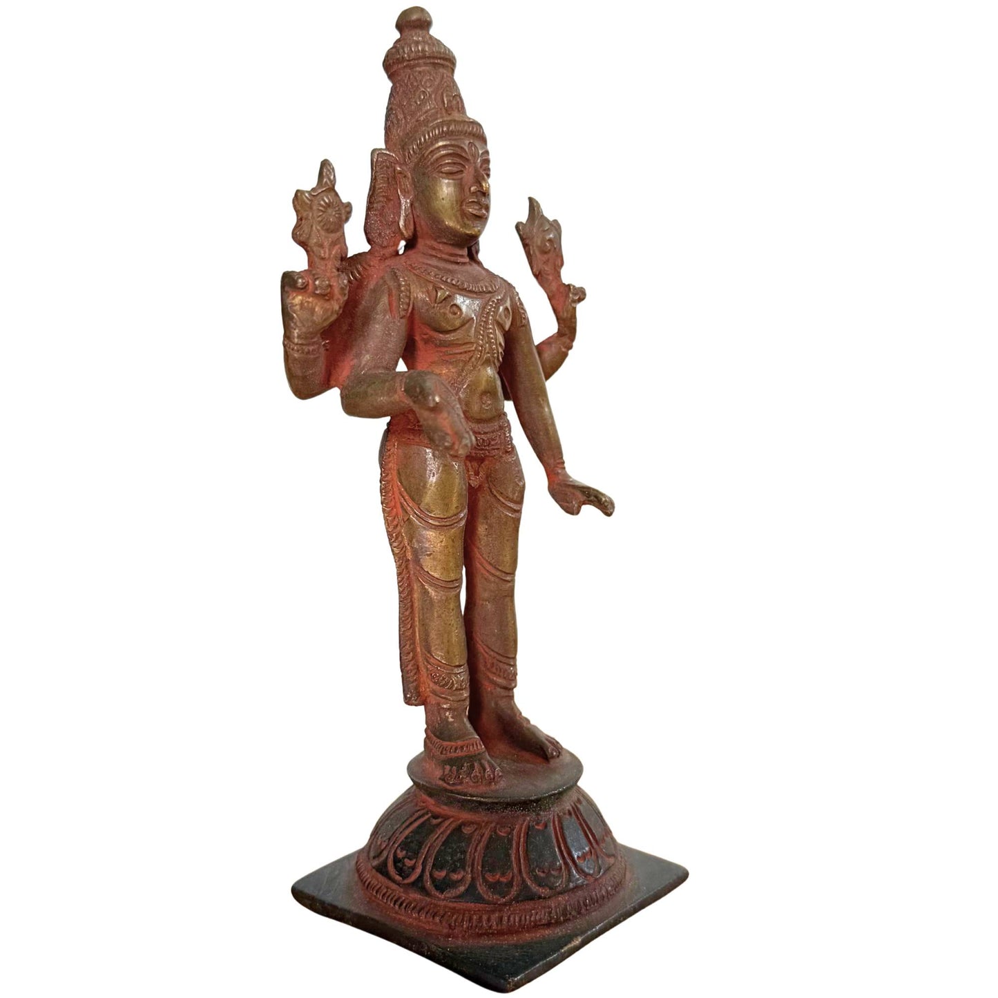 Detail of antique Vishnu bronze with layered ritual sindoor powder under the microscope