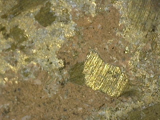 Microscopic confirmation of original fire gilding on a 17th–18th century Khmer Vishnu bust