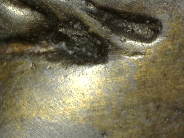 Microscopic image of original fire gilding on a bronze Vishnu bust, Khmer Cambodia, 17th–18th century