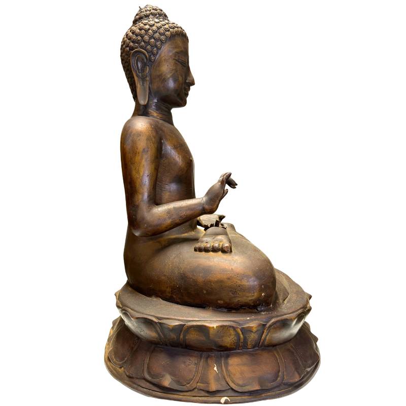 Close-up of the Vitarka Mudra (gesture of teaching and discussion) in bronze.