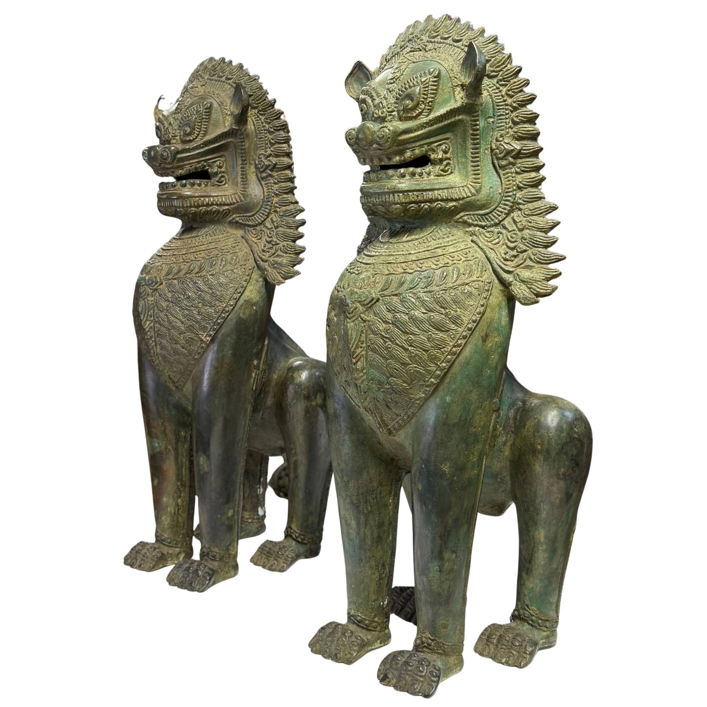 Detail of the characteristic flame-like mane on a Singha lion in old bronze