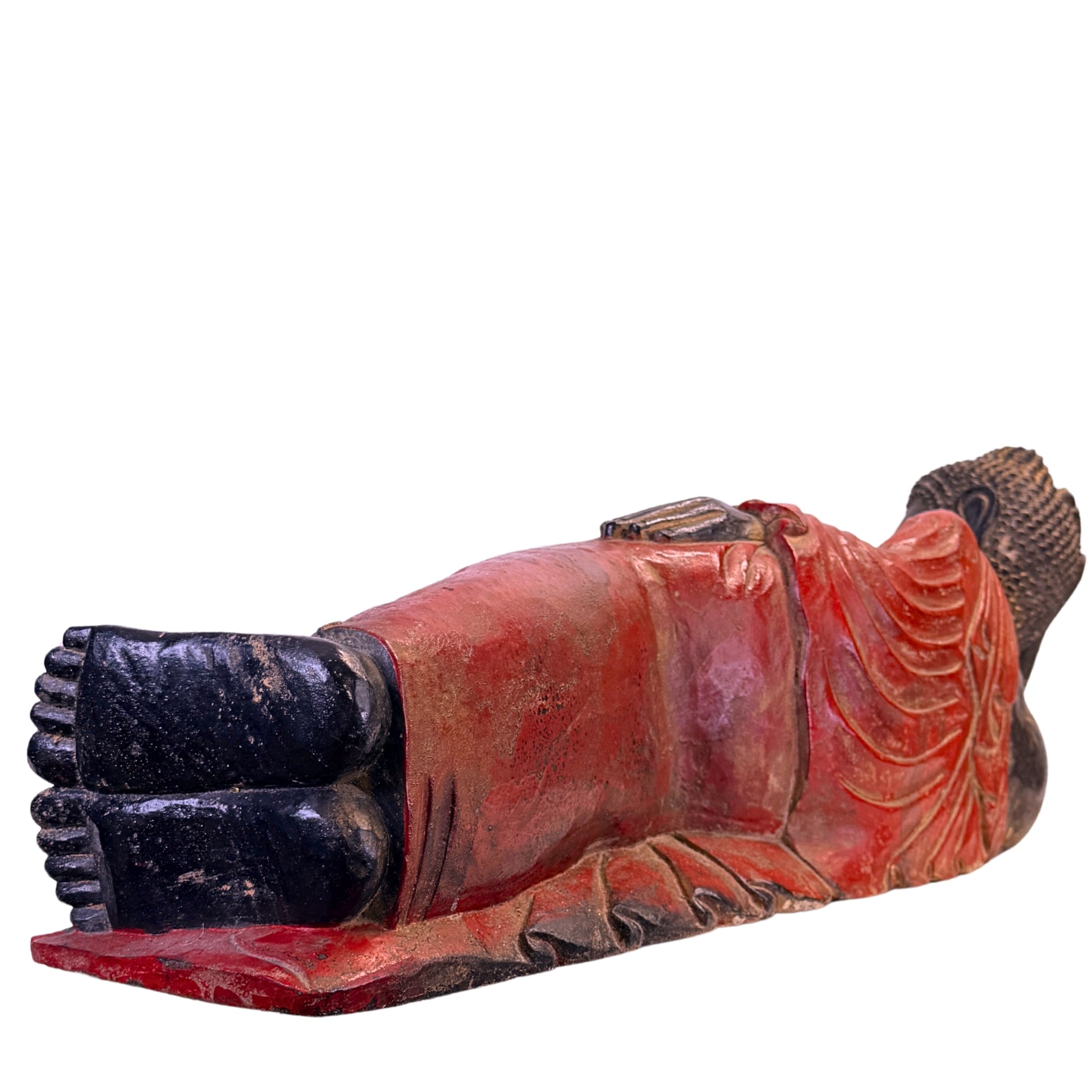 Low-angle view of the feet and red robe of the Burmese Buddha