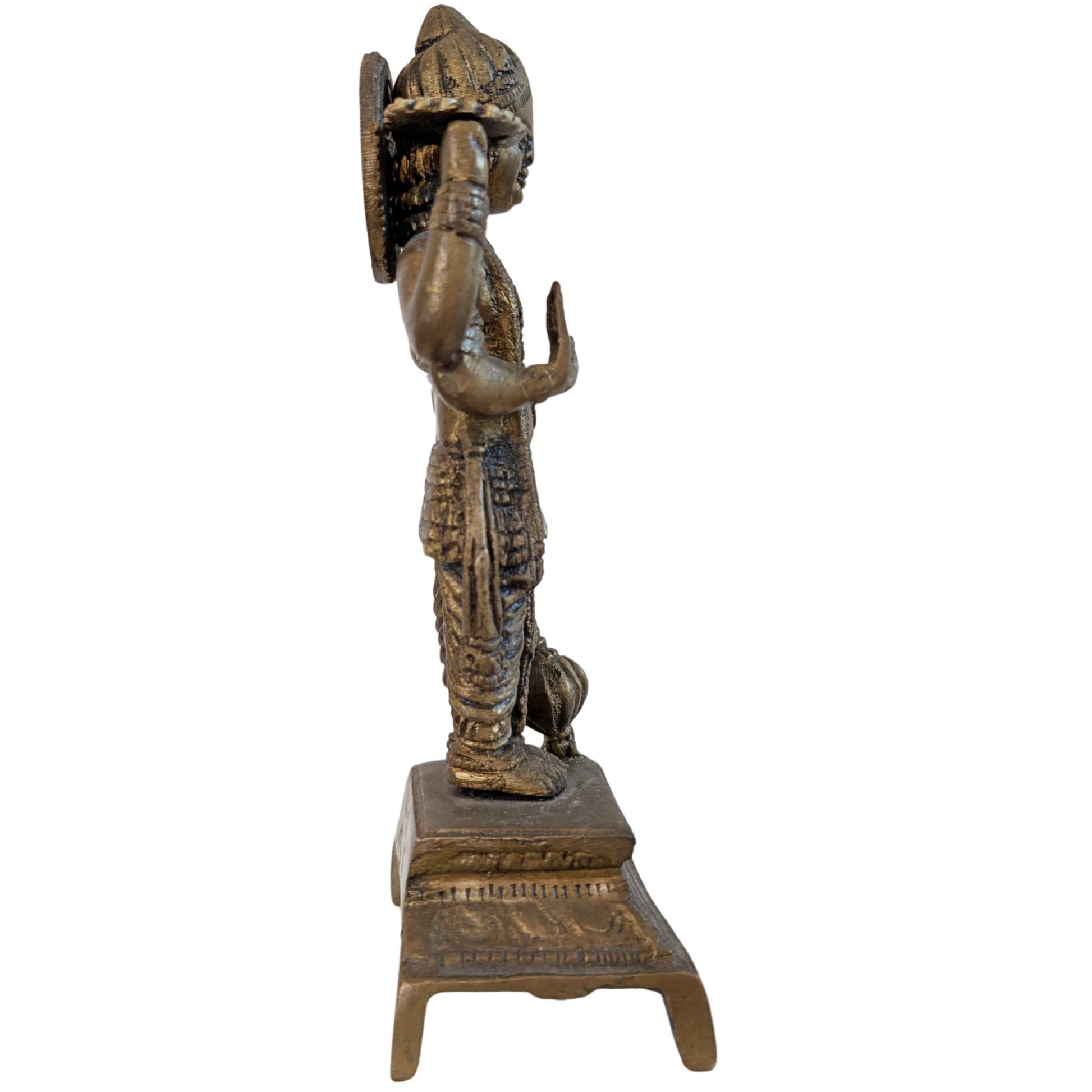 Side view of antique Vishnu statue with details of the Sudarshana Chakra discus