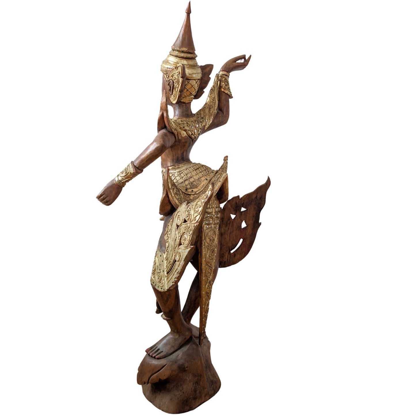 Profile of the elegant Burmese temple dancer in wood carving.