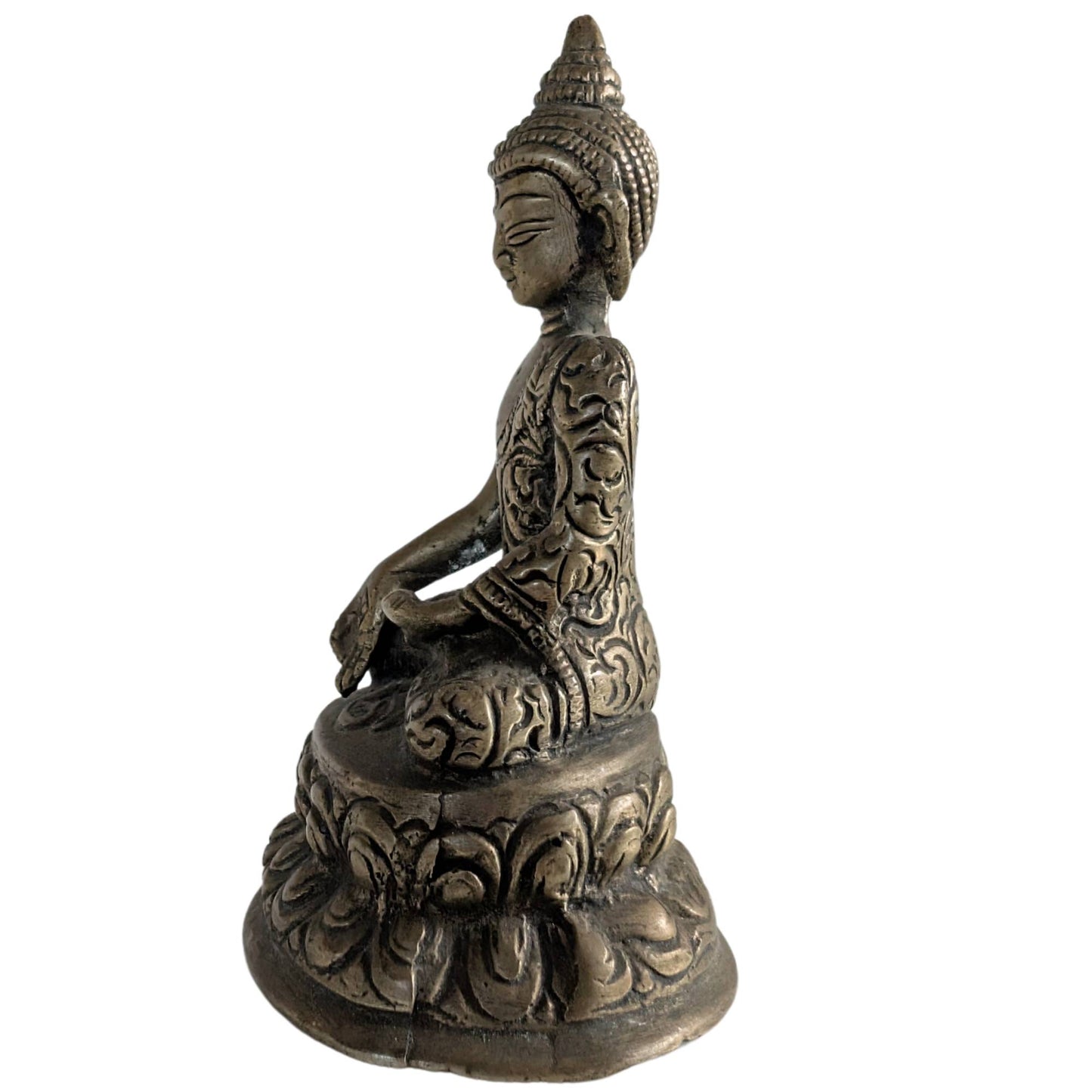 Side view of the seated Buddha figure in traditional Nepalese style.