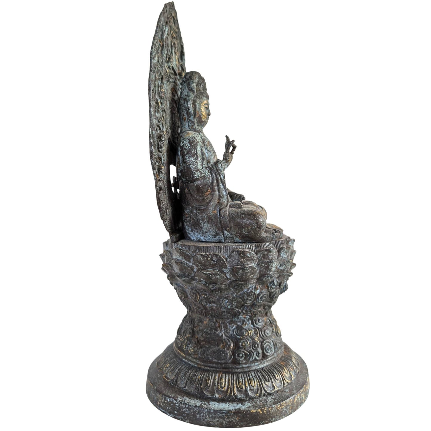 Side view of the monumental Guanyin, with emphasis on the deep mandorla behind the figure.