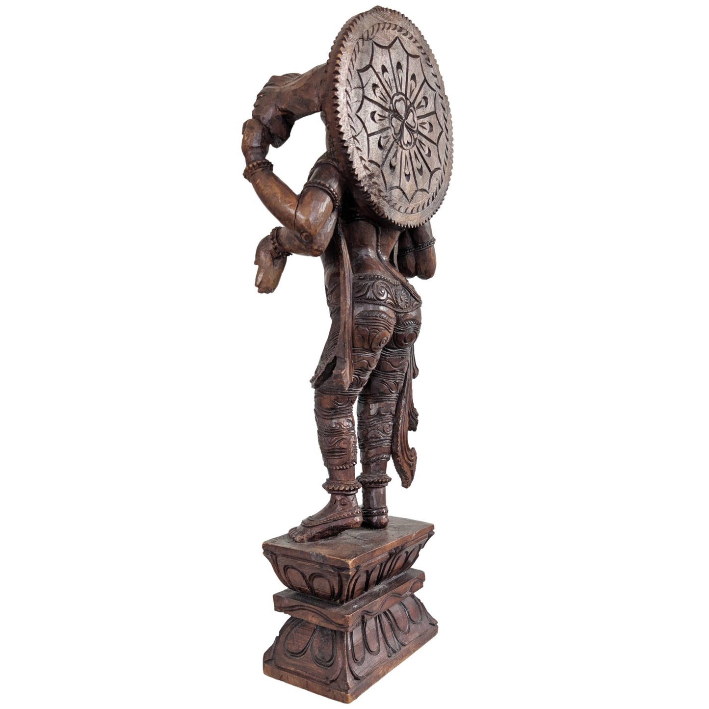 Profile of the hand-carved wooden Vishnu statue from India.