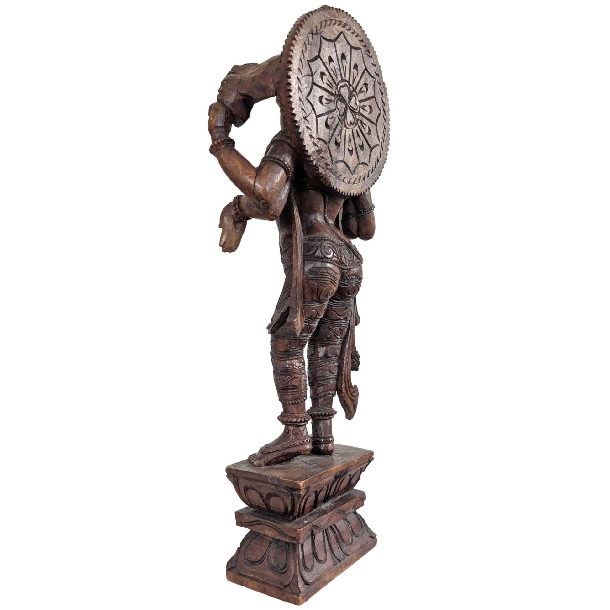 Profile of the hand-carved wooden Vishnu statue from India.