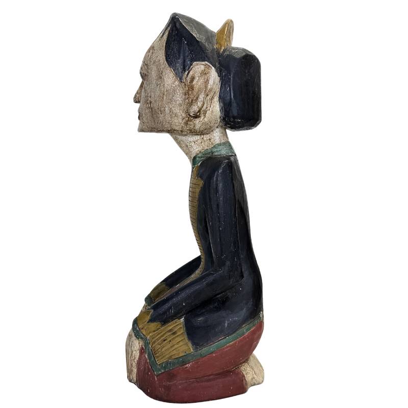 Side view of the teak sculptures showing the depth and mass.
