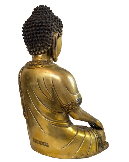 Side view of the 42 cm high gilded Buddha with refined proportions.