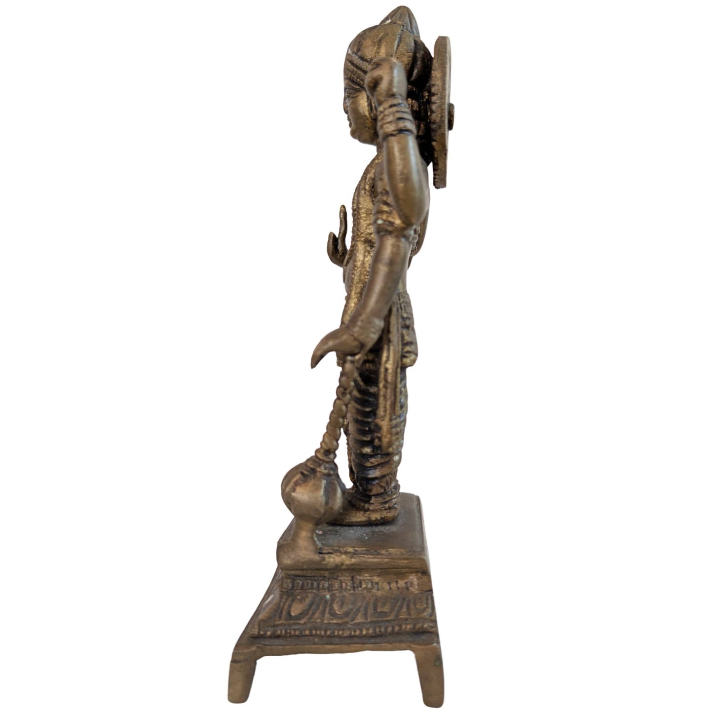 Left side profile of an antique bronze Vishnu statue focusing on the Shanka shell