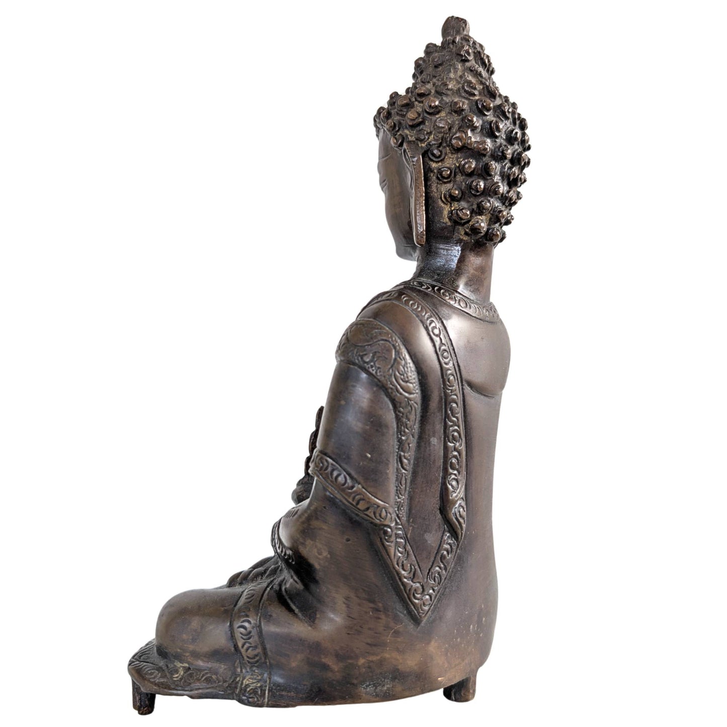 Medicine Buddha seated in the full lotus position on an ornate base.