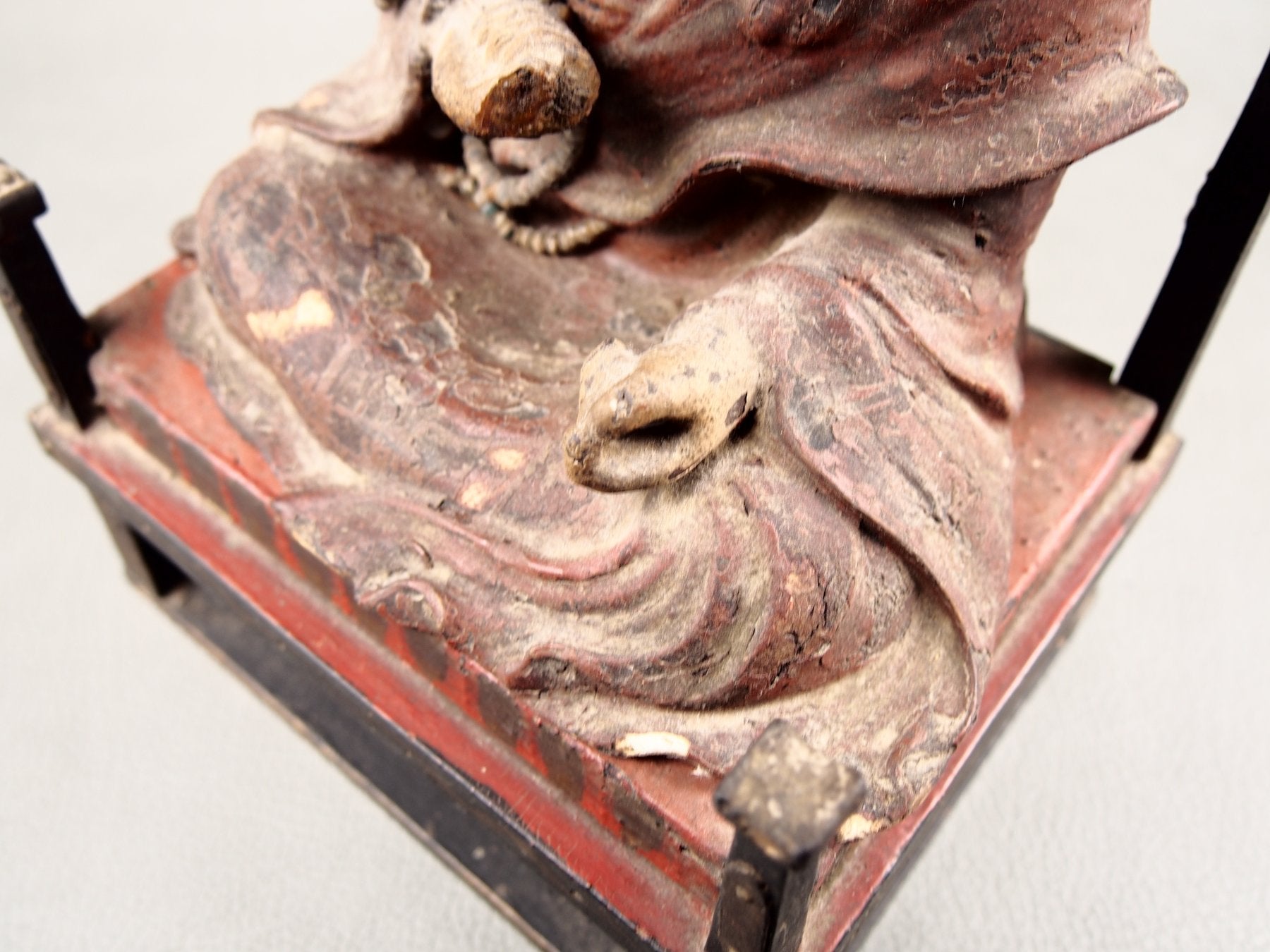 Japanese Zushi shrine with religious wooden statue
