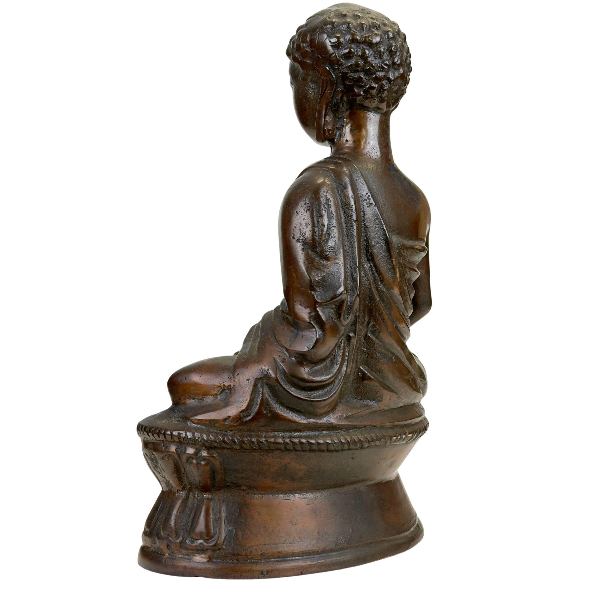 Heavy cast Buddha statue in copper alloy with a thick-walled structure and dark patina